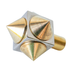 Front-facing view of a spike cube knob with a chrome base and brass spikes, showcasing its contrasting metallic finishes and edgy design.