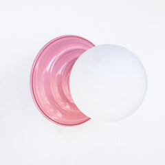 Blush pink simple modern wall sconce with frosted glass shade.  Perfect sconce or ceiling flushmount fixture for small tight spaces.  Adds a pop of pastel pink color.