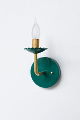emerald green and brass feminine sconce with scalloped bobeche detail.  Feminine bathroom sconce lighting