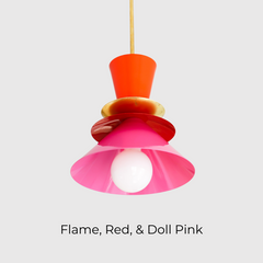 Colorblocked Astro pendant light in vibrant flame orange, deep red, and bright doll pink, finished with a brass accent. This bold mid century modern-inspired ceiling light is perfect for colorful kitchens, eclectic dining areas, or playful interiors. Ideal for maximalist design lovers and fans of retro modern lighting with personality.
