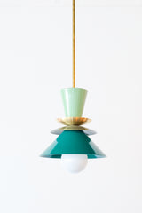 Close-up of the Astro Pendant in Vista Green, Olive Green, and Mermaid Green. This mid-century modern-inspired pendant features a playful combination of colors, with a glossy green top cone, metallic dish accents, and layered conical shades, suspended from a sleek rod.