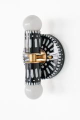 Handpainted black and white patterned wall sconce inspired by Greece & Portugal.  Maximalist style wall sconce that has a natural element because each one is hand-painted.  The painted thalia is a perfect small sconce that doubles as a statement light fixture because of the bold design.  Great for bathrooms, hallways, and more.