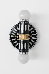 Handpainted black and white patterned wall sconce inspired by Greece & Portugal.  Maximalist style wall sconce that has a natural element because each one is hand-painted.  The painted thalia is a perfect small sconce that doubles as a statement light fixture because of the bold design.  Great for bathrooms, hallways, and more.