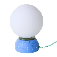 Handmade modern blue ceramic table lamp with olive rim and raised drip texture, topped with a glowing round white glass globe shade. Unique artisan lighting for nightstands, desks, and bedroom accent décor. Perfect small modern bedside lamp for colorful, eclectic, or mid century inspired interiors.