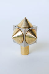 Front view of a raw brass spike cube knob, showing its solid brass build and unlacquered finish that will develop a natural patina over time.