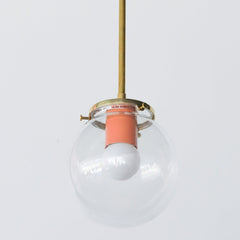 Brass and Glass kitchen or bathroom pendant light fixture with a pop of peach color