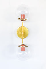 modern brass and peach wall sconce for bathrooms