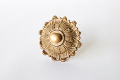 The Soleil knob features a cast brass sun-shape with a modern cap.  Adds a touch of regency to any home decor. The cast brass component of the knob is made in italy.  Adds texture to any antique or modern piece of furniture and cabinetry. Beautiful, rich raw brass finish. The raw brass finish will develop a patina with time.