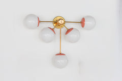 Peach and Brass Large Modern wall sconce with five lights. Eclectic modern with a nod to mid century style design