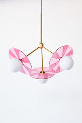 Mid-century modern pendant light for kids' room in medium pink and brass