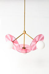 Handcrafted pendant light featuring intricate etched acrylic discs for a captivating lighting effect.