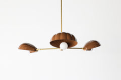 Statement ceiling light fixture with retro-modern scalloped shades in powder-coated fudge brown steel, arranged in a radial design and supported by luxe brass detailing. A perfect blend of maximalist design, warm beach house aesthetics, and midcentury glamour—well-suited for modern kitchens, coastal living rooms, or a Nancy Meyers-style bedroom.