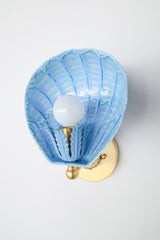 One-of-a-kind Coquille wall sconce in celestial blue, cream, and cobalt hand-painted powdercoated steel with polished brass hardware, handmade in New Orleans and inspired by seashell forms