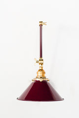 Black Cherry and brass adjustable wall sconce that adds colors and directed lighting anywhere it is needed.