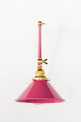 Doll Pink and Brass adjustable wall sconce with a classic conical shade.  This adjustable wall sconce features a classic conical shade with a modern twist on finishes. Perfect for adding a touch of industrial chic to your space.
