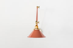 Peach & Brass Adjustable Wall Sconce in a fun color with a cone shade.  Makes a great wall sconce for kitchen lighting, pictures, and more.