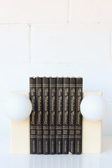Steel Powdercoated lamp in cream with white glass globe.  Plug in Bookshelf lamp.