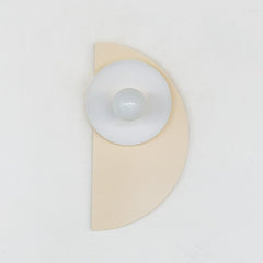 Geometric Kin Sconce in a serene cream and peach colorway with warm brass accents. This bold yet soft fixture blends Memphis-inspired form with timeless tones—ideal for mid-century modern, Scandinavian, or eclectic homes.