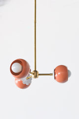 Peach and Brass chandelier with white daisy flower detail.  Feminine 60s style small chandelier adds a pop of color and whimsy to any small space like bedroom, playroom, office, or bathroom design