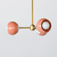 Peach and Brass chandelier with white daisy flower detail.  Feminine 60s style small chandelier adds a pop of color and whimsy to any small space like bedroom, playroom, office, or bathroom design