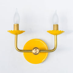 Yellow & Brass two light wall sconce with feminine scalloped details. Modern and colorful chinoiserie style wall light fixture.