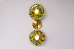 Modern two light wall sconce with brass hardware. Features resin-encapsulated greenery, ferns, and leaves.  Adds a real-like nature theme to any interior design project.  Called the Botanico Sconce by Sazerac Stitches. Features green and yellow leaves & greenery