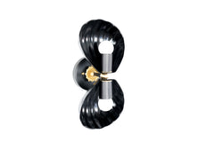 Statement black and gold Coquille Sconce with symmetrical clam shell shades, combining maximalist, vintage, and coastal influences in a unique lighting fixture.