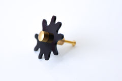 Glossy Black Acrylic & Brass modern and artistic paint splat inspired drawer pull knob.  Colorful asymmetric acrylic drawer pull or knob with brass details. Adds a unique touch to dressers, cabinets, and more.  Comes in pearly, glossy, and translucent acrylic in a ton of colorful option.  Adds a playful touch to 90s aesthetic or a kid-friendly space.  Unique drawer pull made to order in New Orleans. Designed by Sazerac Stitches.  Easy to install!