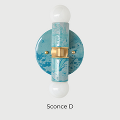 Close-up view of the Teal and Grey Marbled Thalia Sconce, a modern double-bulb wall light featuring hand-marbled teal and grey enamel with solid brass accents. This sculptural lighting fixture blends artistic flair with function, making it a standout in bathrooms, powder rooms, or hallways.