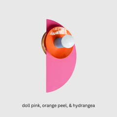 Memphis meets modern in this dynamic Kin Sconce, shown in a saturated palette of doll pink, orange peel, and hydrangea blue. The half-circle backplate and nested disc form a geometric composition that nods to Bauhaus principles with a pop-art twist. Set against a distorted lilac checkerboard surface, this piece is perfect for playful interiors, gallery walls, or anywhere bold design is welcome.