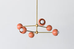 Brass and Peach Mid century modern style dining room or living room chandelier.  Fun way to add color to any space.