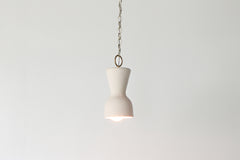 Cream and brass chained ceramic pendant lighting fixture. Made in the USA hand-cast tinted porcelain pendant kitchen light with real raw brass chain.  Beautiful unglazed porcelain ceramic pendant ceiling light fixture.