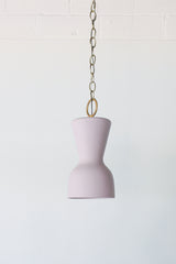 Pastel purple and brass chained ceramic pendant lighting fixture. Made in the USA hand-cast tinted porcelain pendant kitchen light with real raw brass chain.  Beautiful unglazed porcelain ceramic pendant ceiling light fixture.