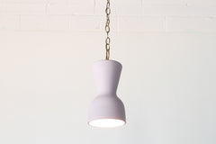 Pastel purple and brass chained ceramic pendant lighting fixture. Made in the USA hand-cast tinted porcelain pendant kitchen light with real raw brass chain.  Beautiful unglazed porcelain ceramic pendant ceiling light fixture.