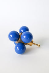 Oversized Ball Cube drawer pull with five glossy Mediterranean Blue spheres arranged around a solid brass cube core. A bold and sculptural hardware piece designed to stand out, this large-scale knob is perfect for dressers, armoires, or custom furniture. Handmade and ideal for midcentury modern, maximalist, eclectic, or color-forward interiors. Not recommended for small-scale drawers or kitchen cabinets.