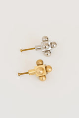 A set of two decorative knobs in brass and polished nickel, each featuring a cubic base with spherical accents.