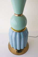 Close-up of the ribbed aqua ceramic base and mint green sphere detail of the Mint & Ceramic Aqua Table Lamp, accented with polished brass trim. The artisan design combines vintage-inspired curves with bold color blocking for a playful mid-century modern aesthetic.