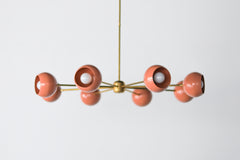 Peach and Brass mid century modern large chandelier with peach colored shades.  Adds a ton of light and style with a pop of Pantone's 2024 color of the year, peach fuzz.