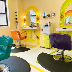 Colorful Salon with colorblocked neon colored wall sconces