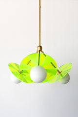 Handcrafted pendant light featuring intricate etched acrylic discs for a captivating lighting effect.