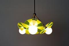 Mid-century modern pendant light fixture with colorful, etched acrylic discs.