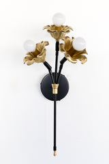 black and brass floral wall sconce.  Each socket includes a large brass flower.  Romantic and unique wall mounted wall sconce with three sockets.  Black and brass finish adds modernity