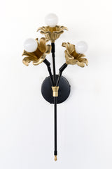 black and brass floral wall sconce.  Each socket includes a large brass flower.  Romantic and unique wall mounted wall sconce with three sockets.  Black and brass finish adds modernity