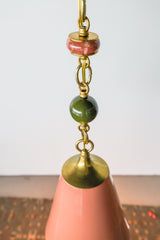 Close-up of the Peach, Olive, & Rose Marble Beaded Pendant Light showing rose marble disc, olive bead, and polished brass chain links.