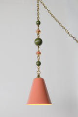 Full view of the Peach, Olive, & Rose Marble Beaded Pendant Light with peach cone shade, brass cap, and beaded chain featuring olive and rose marble accents.