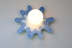 pastel blue paint-splatter shaped wall sconce by sazerac stitches