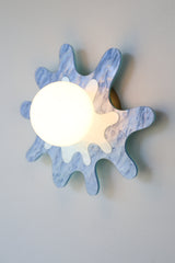 pastel blue paint-splatter shaped wall sconce by sazerac stitches