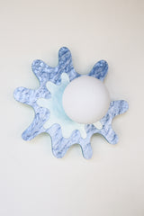 pastel blue paint-splatter shaped wall sconce by sazerac stitches