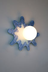pastel blue paint-splatter shaped wall sconce by sazerac stitches