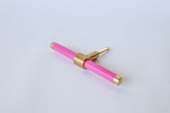 Hot Pink and brass modern drawer pull.  Add color to cabinets with brass accents with the Piety drawer pulls by sazerac stitches.  Available in over 30 colors with the option to customize. Center mount installation drawer pull with color and brass accents.  Sophisticated colorful bathroom, dresser, vanity, or desk drawer pull.